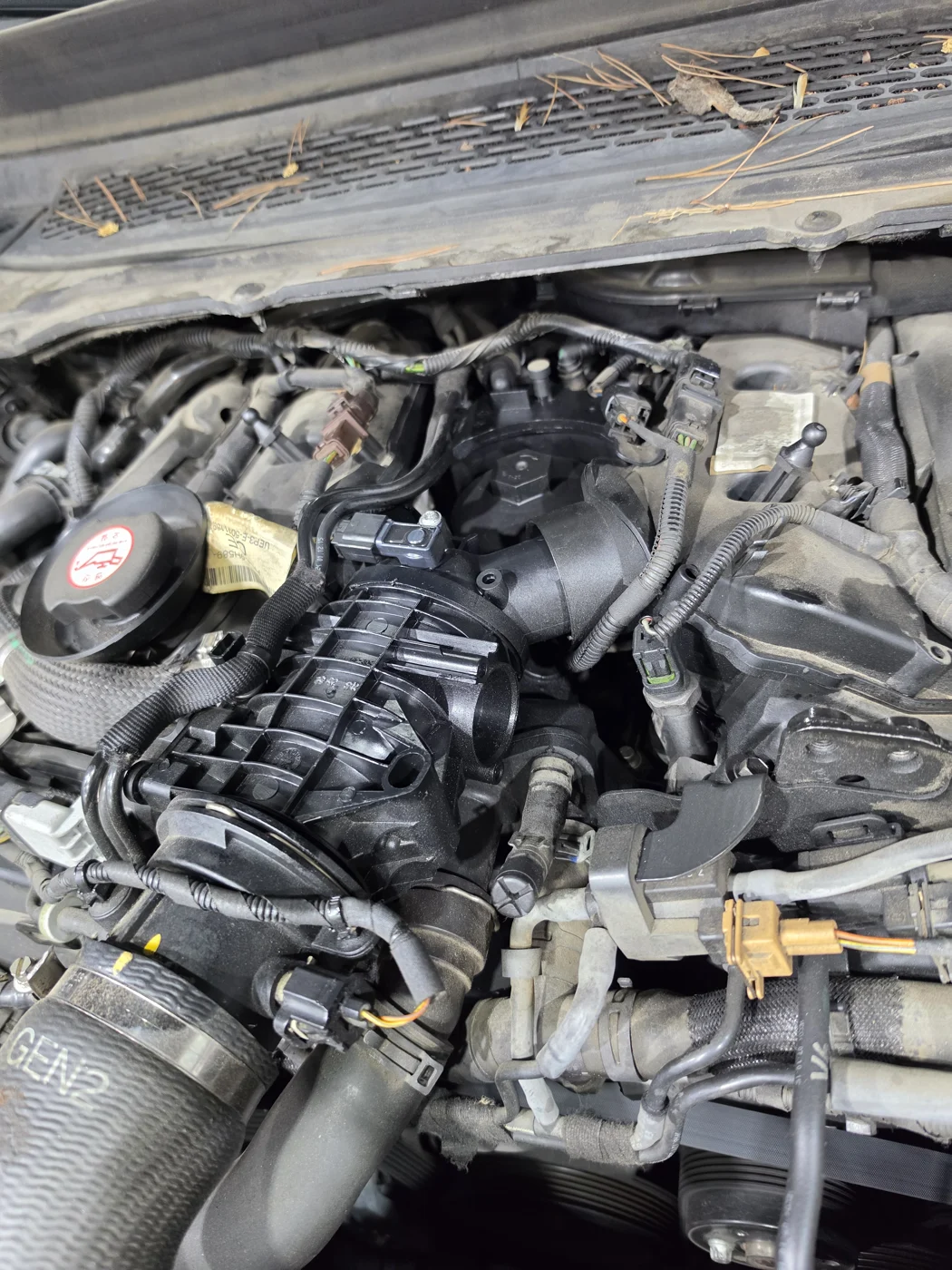 Checking the engine area, including the oil filter housing