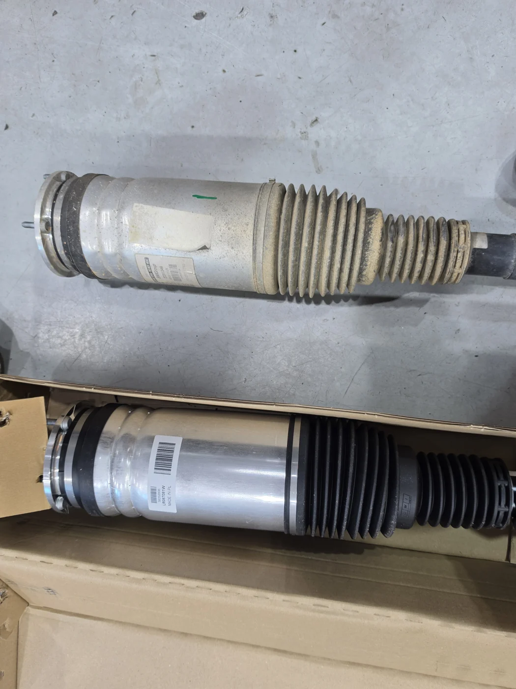 Old air strut compared with its replacement