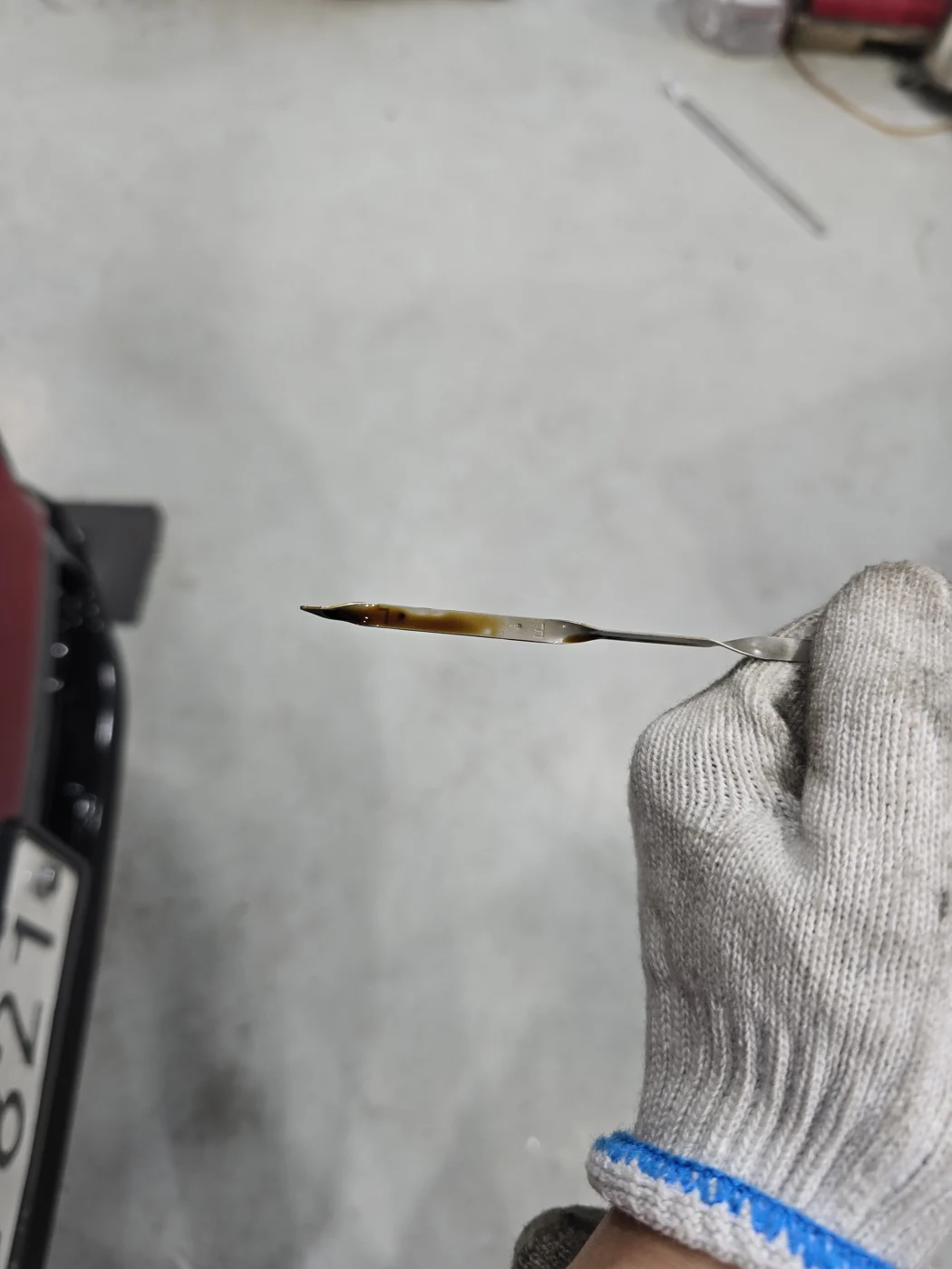 Checking the dipstick before the change