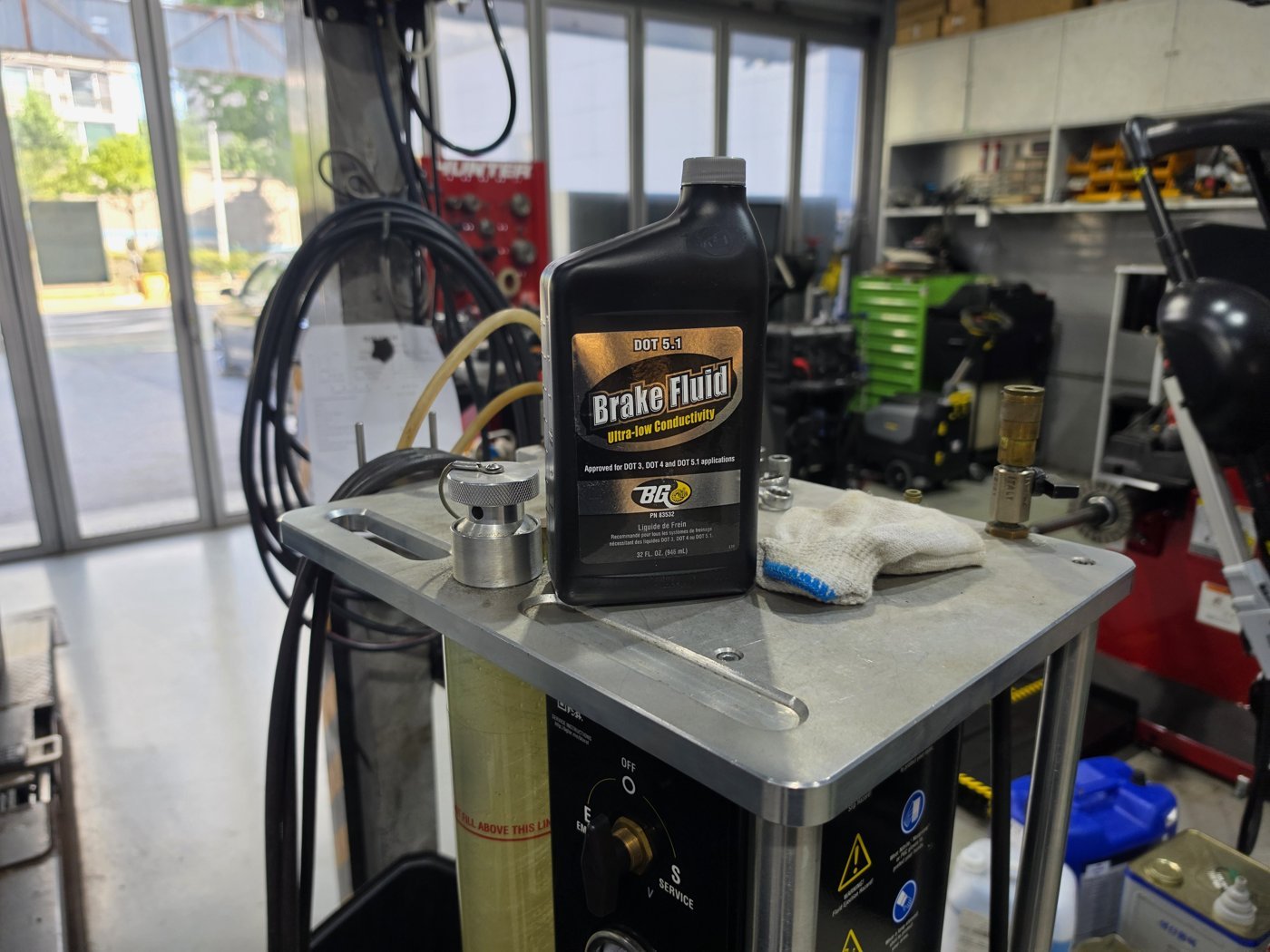 Brake fluid service equipment connected.