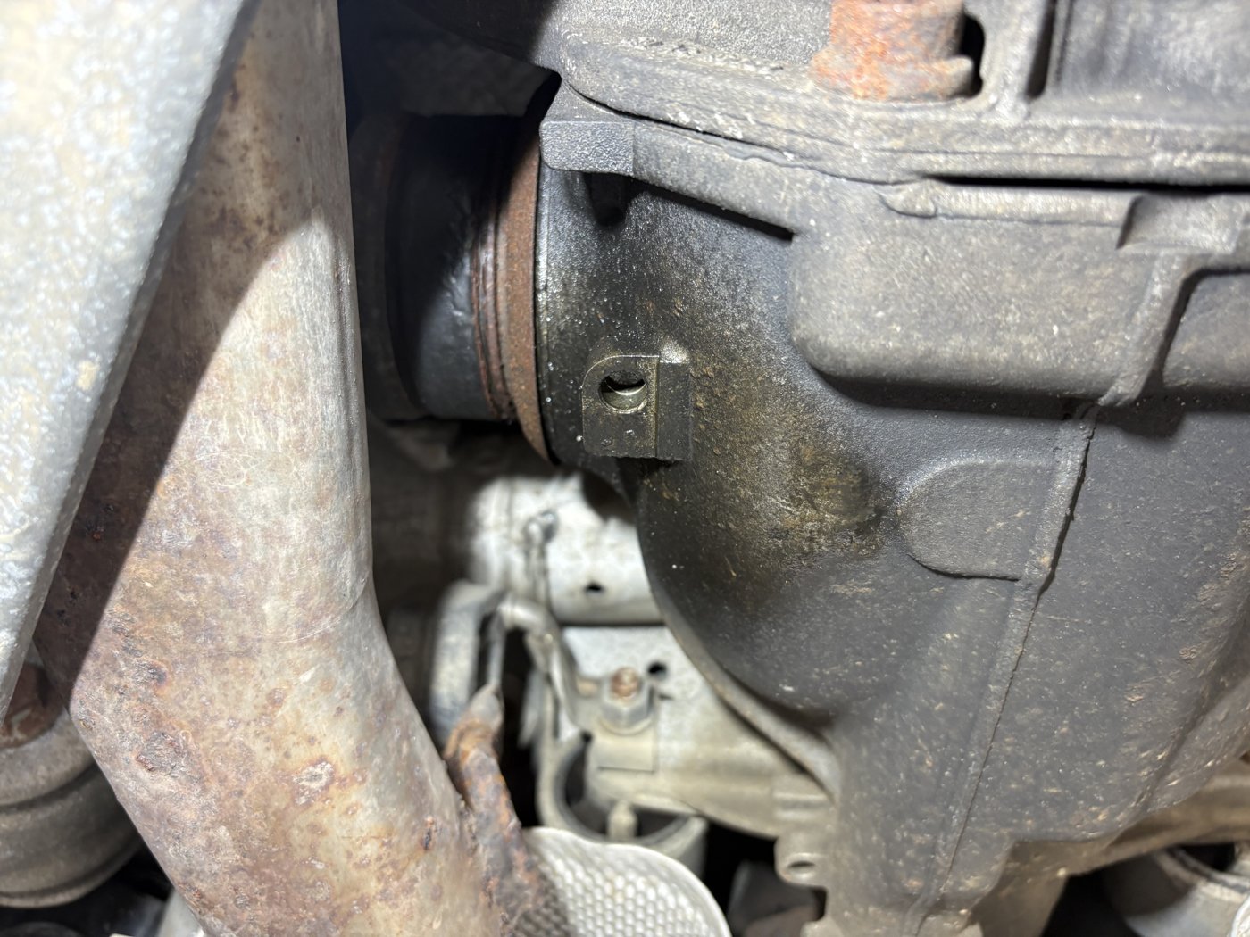 Oil traces on the surface of the differential housing.