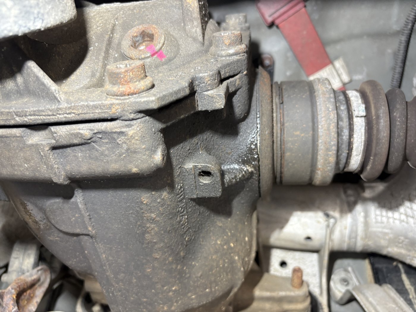 Close-up of the wet area around the axle shaft connection.