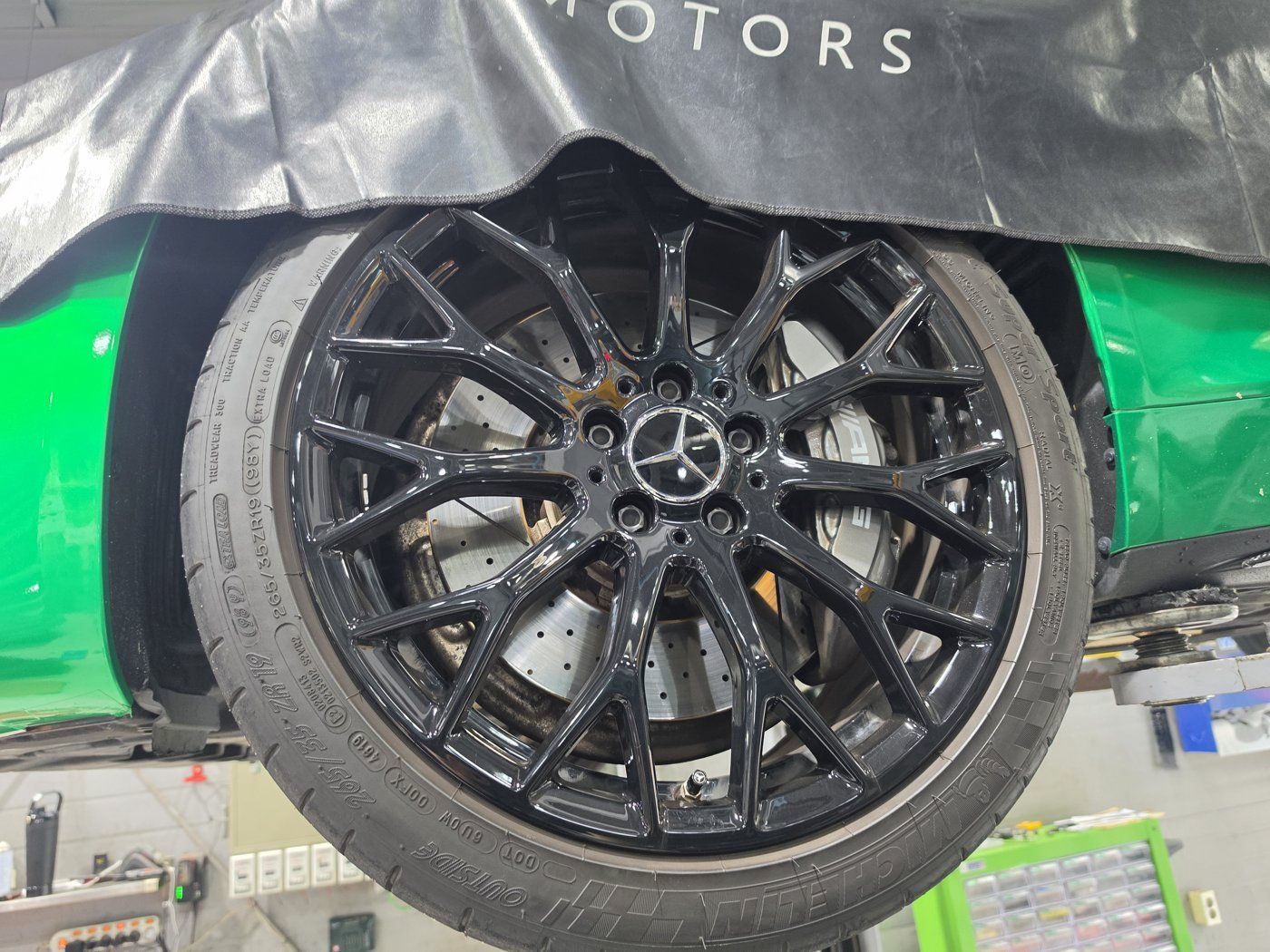 The wheels and tires, inspected on the lift at the same time.