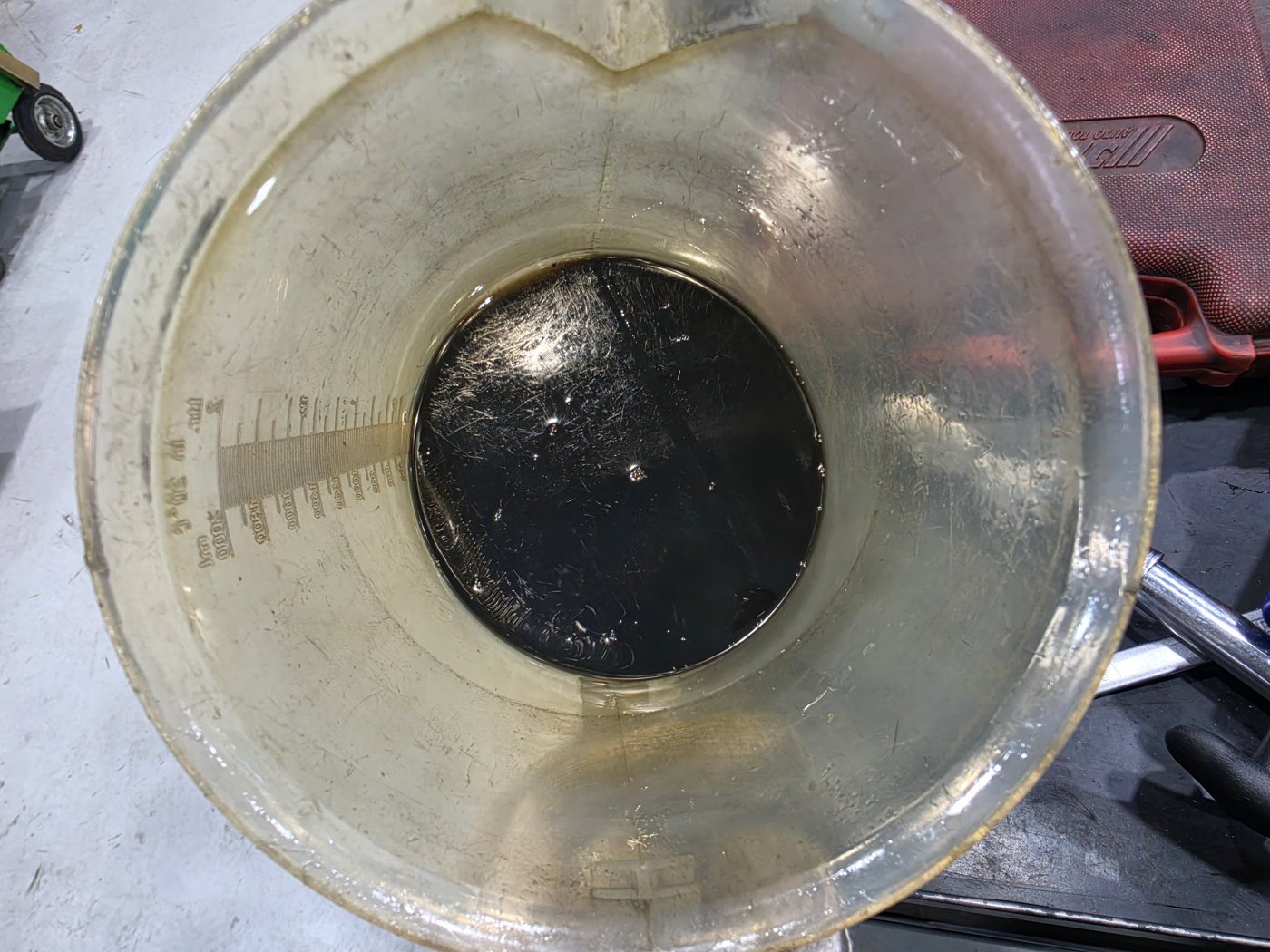 Drained oil collected in a measuring container