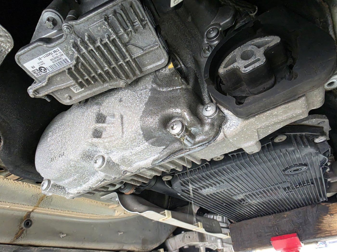 Oil service around the transfer case, under the car