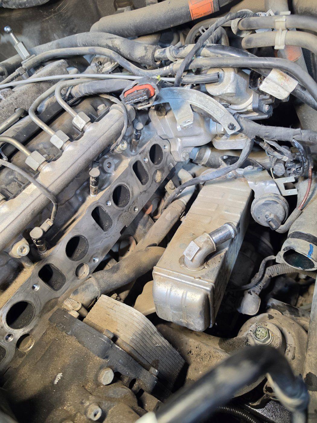Engine intake ports and mating surface with the manifold removed.