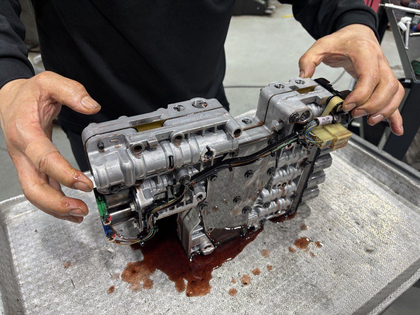 The valve body removed from the car, with its connected wiring.
