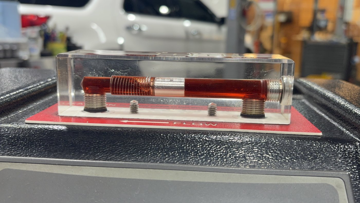 Fluid flow seen through the machine's sight window during the exchange.