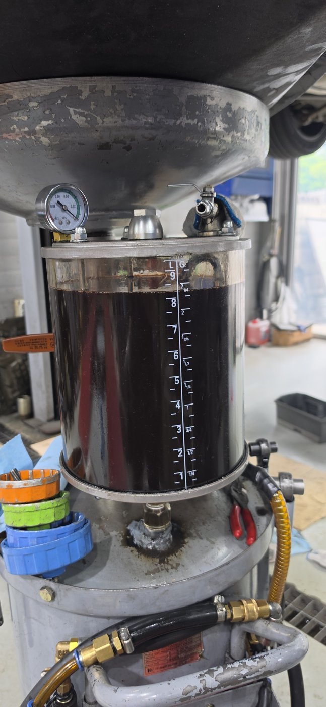 Fluid drained and collected while opening the oil pan.