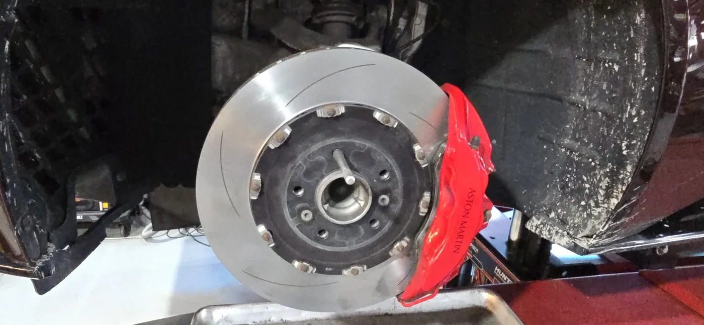 The brake disc refitted to the car after refinishing.