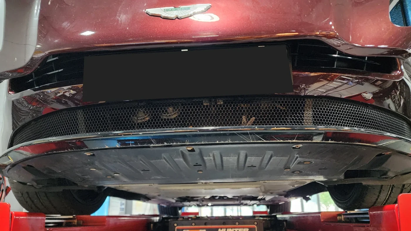 DB11 V12 on the lift for an underbody inspection.