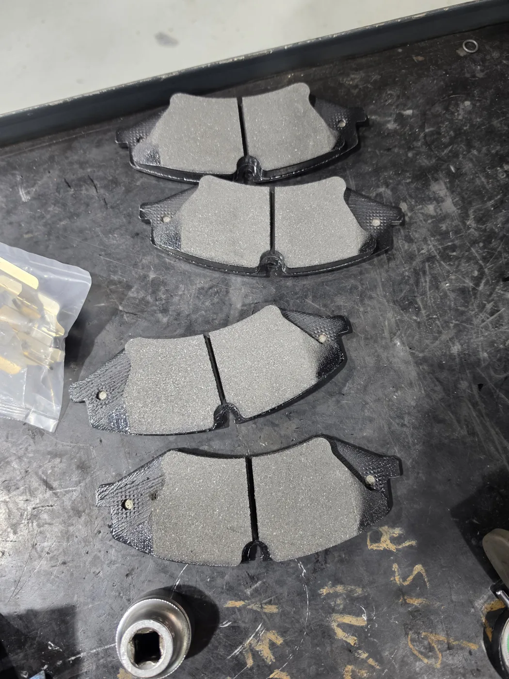 Removed front pads and the new Textar pads