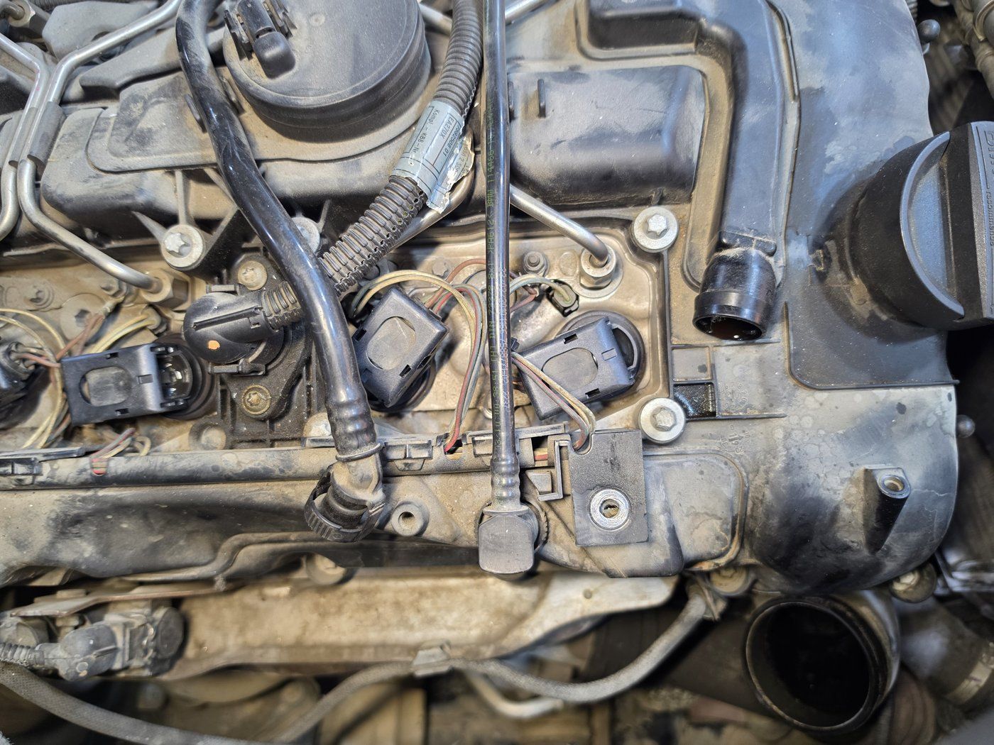 Top of the engine with new coils and connectors fitted in all six positions