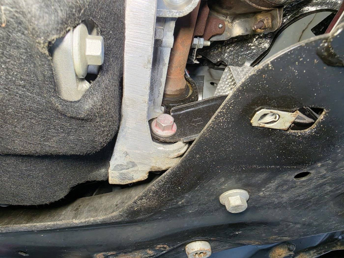 Underbody drivetrain inspected on the lift