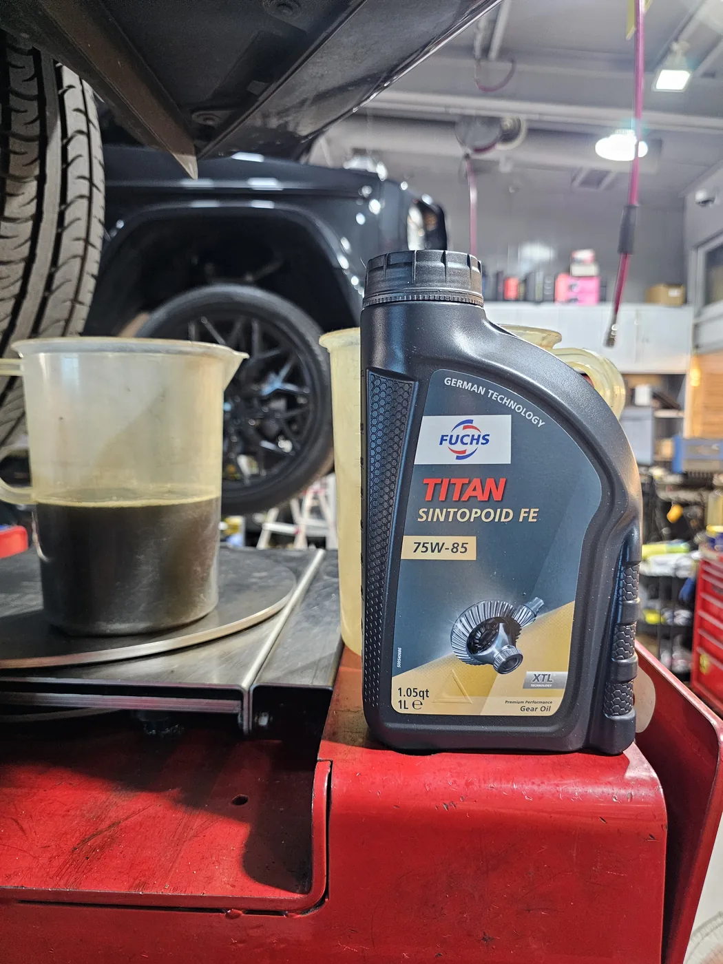 Collected oil and replacement fluid during G63 driveline maintenance