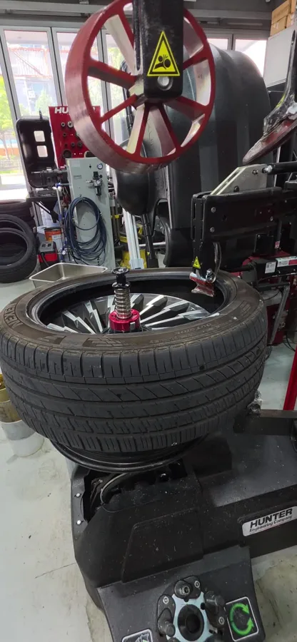 Hunter Revolution tyre changer · frame from the fitting video.