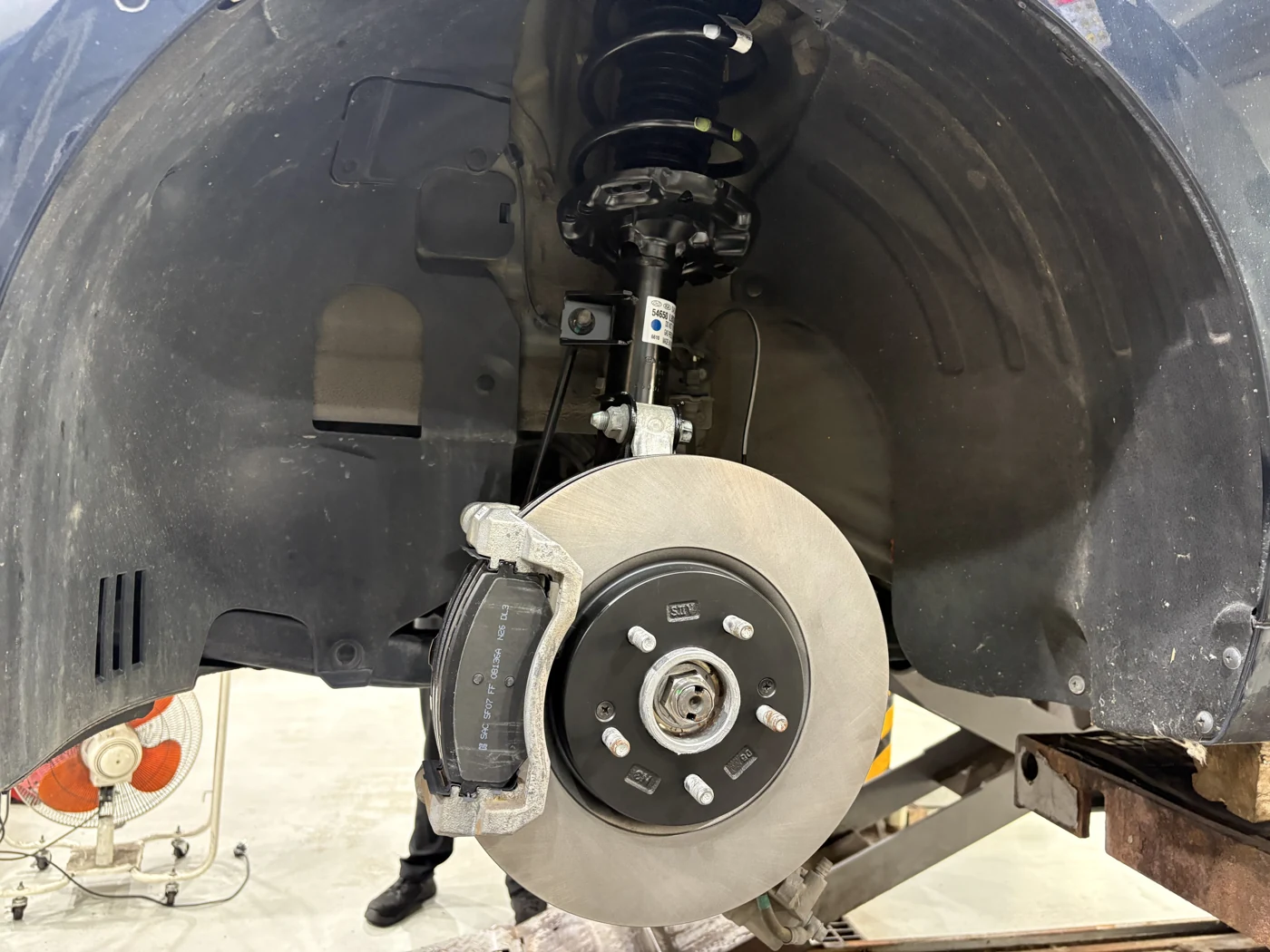Front strut and brake components after installation.