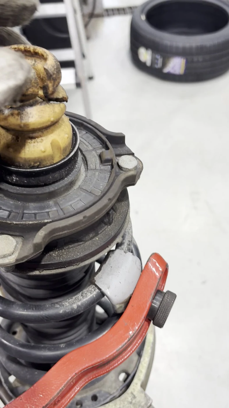 The old bump stop exposed during disassembly. Frame from this car’s workshop video.