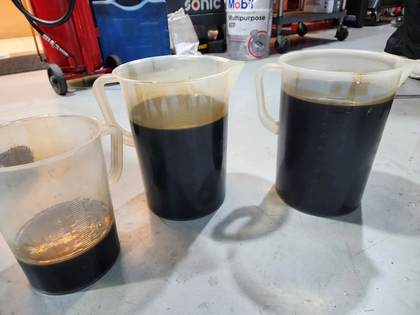 Drained engine oil collected for inspection