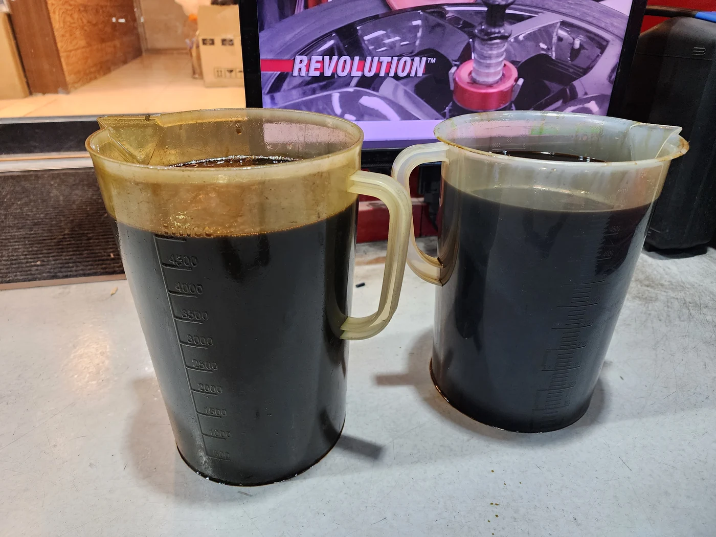 Drained engine oil collected for inspection