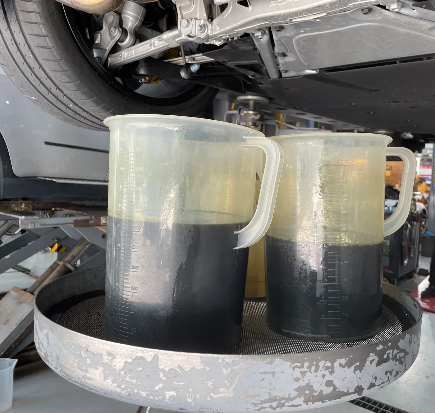 Drained engine oil collected for inspection