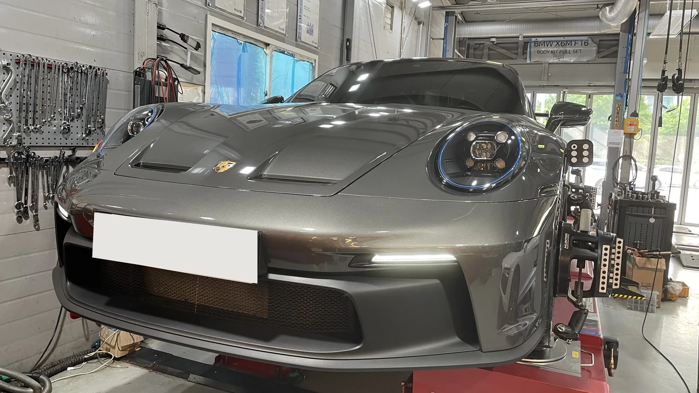 The actual 911 GT3 on the alignment rack in June 2024