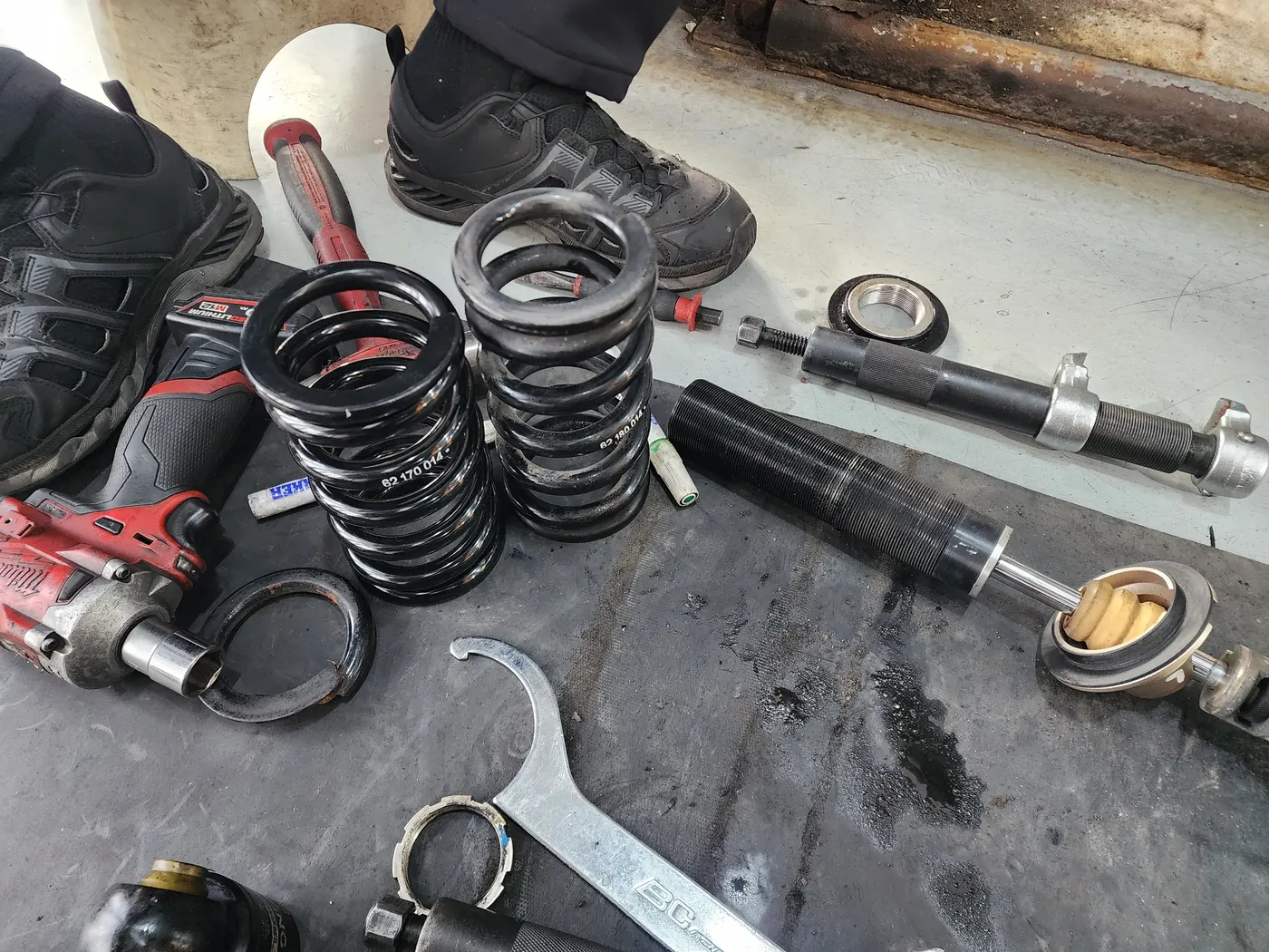 The new spring on the left and the removed spring on the right
