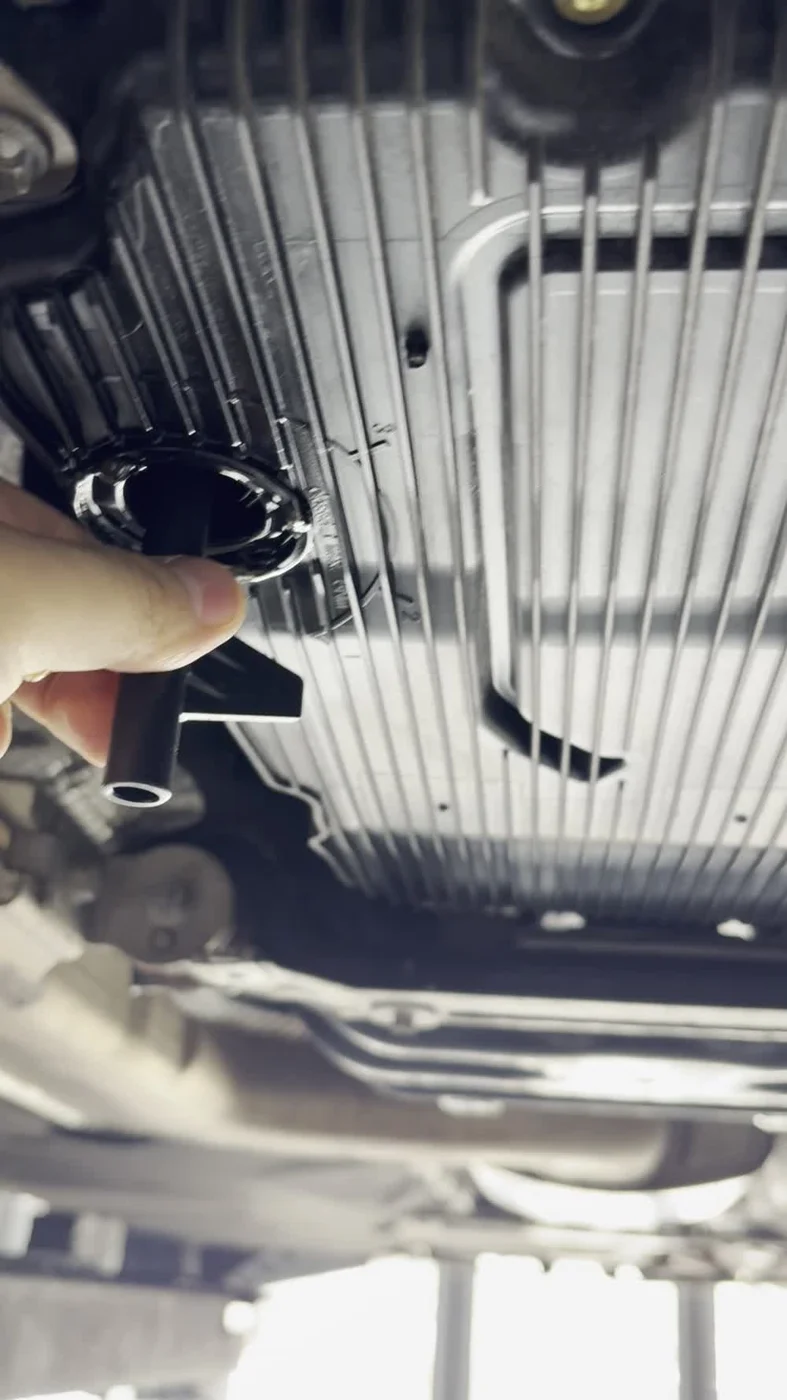Transmission-fluid level setting, captured from the work video